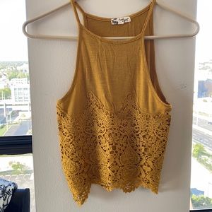 Boutique crop top with lace feature.